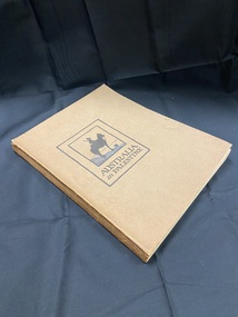 Brown cardboard cover. Black rectangle outline just off centre on the cover, inside it is a black square border containing a silhouette of a soldier on horseback, beneath this the title is printed in black.