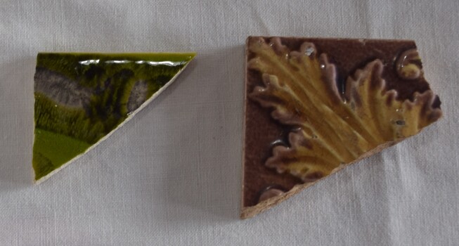 Two pieces of broken tiles made in the 19thC. 