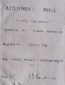 Handwritten bookplate from a children's adventure story, Our Secret Society, with cloth bound hard cover with drawing of a boy with a dog, next to a window. Book presented as an Attendance Prize to William Fry at Garibaldi School, 1931.