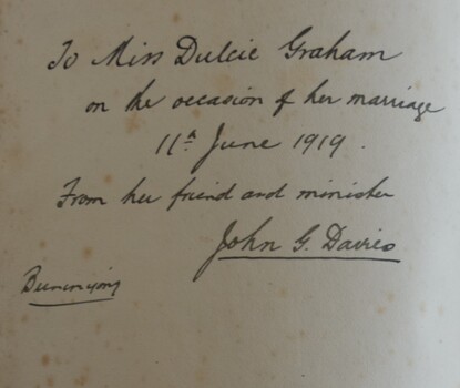 Inscription of inside cover of a black, leather covered Bible, presented to Miss Dulcie Graham on the occasion of her wedding by her friend and minister, John D Davies, on 11 June, 1919.