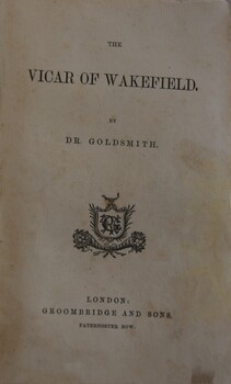 Title page of a hard covered, cloth bound book entitled The Vicar of Wakefield, by Dr. Goldsmith.