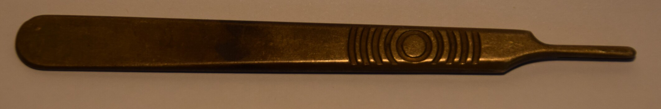 A Swann-Morton scalpel handle made in England after 1932. 