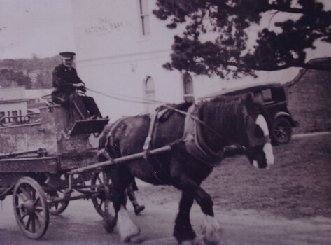 Reproduction of a black and white photograph of a horse-drawn Buninyong fire cart, undated.