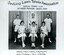Group of tennis players holding racquets