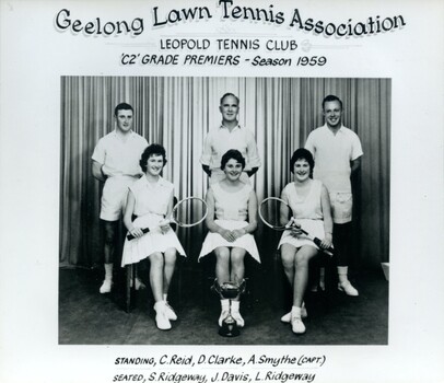 Group of tennis players holding racquets