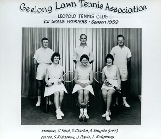 Group of tennis players holding racquets