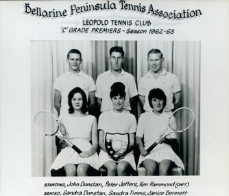Group of tennis players holding racquets