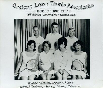 Group of tennis players holding racquets