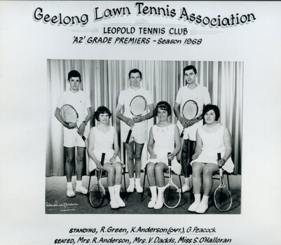 Group of tennis players, some holding racquets