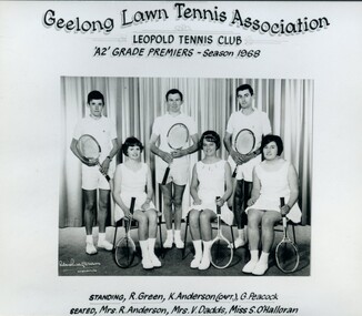Group of tennis players, some holding racquets