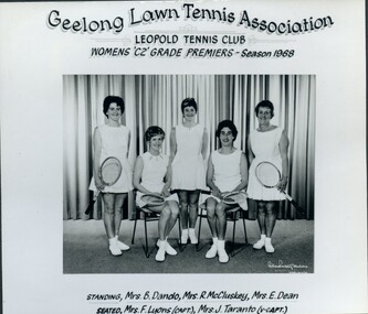 Group of tennis players, some holding racquets