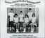 Group of tennis players, some holding racquets