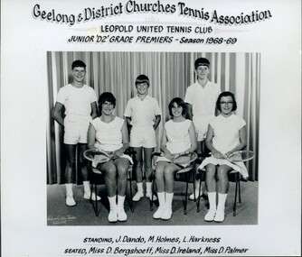 Group of tennis players, some holding racquets