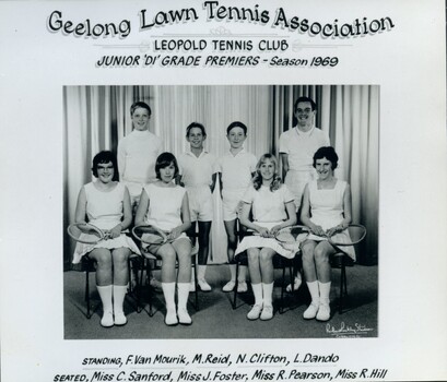 Group of tennis players, some holding racquets