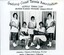 Group of tennis players, some holding racquets