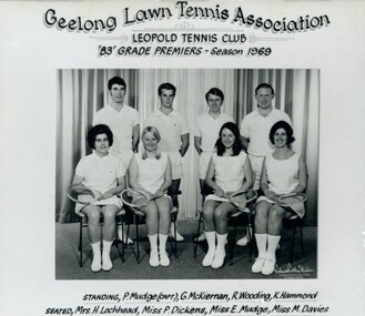 Group of tennis players, some holding racquets