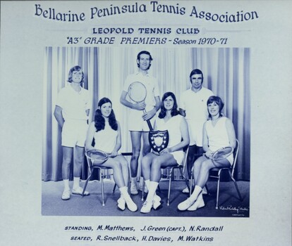 Group of players holding racquets.