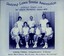 Group of tennis players holding racquets.