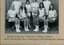 Group of tennis players holding racquets.