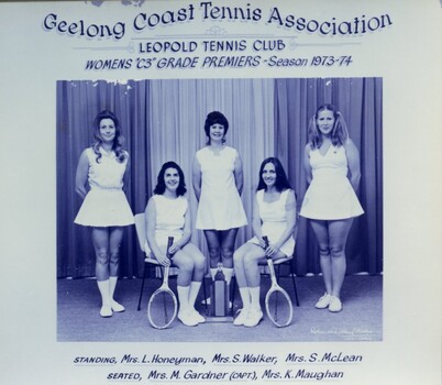 Group of tennis players holding racquets