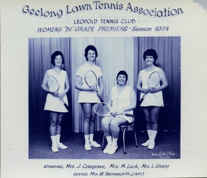 Group of tennis players holding racquets
