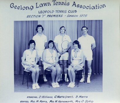 Winning divisional team with tennis racquets