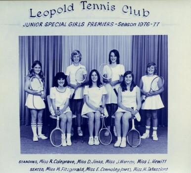 Winning divisional team with tennis racquets