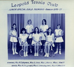 Winning divisional team with tennis racquets