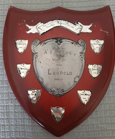 Wooden shield with inscribed silver metal plates