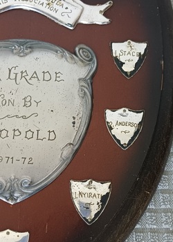 Wooden shield with silver metal plates