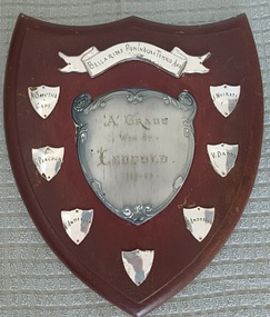 Wooden shield with inscribed silver plates