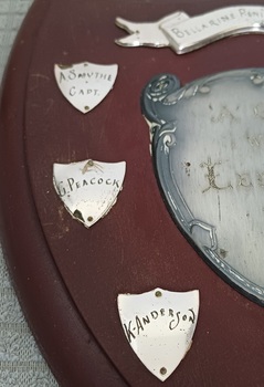 Wooden shield with inscribed silver plates