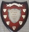 Wooden shield with inscribed silver plates