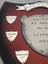 Wooden shield with inscribed silver plates