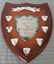Wooden shield with inscribed silver plates