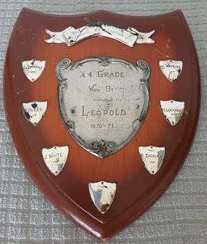 Wooden shield with inscribed silver plates