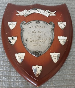 Wooden shield with inscribed silver plates
