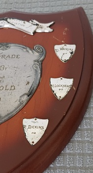 Wooden shield with inscribed silver plates