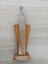 Wooden column with wings and tennis player on top