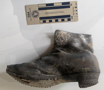 Hand made leather boot that has some signs of decay. 