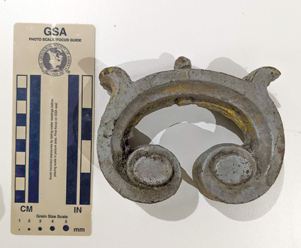 Iron object in a semi-circular shape.  