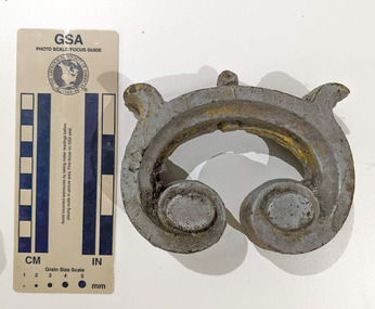 Iron object in a semi-circular shape.  