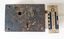 Corroded door lock mechanism with a key hole. Some oxidation has occurred. 