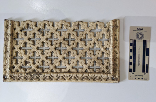 Ventilation grate with an geometric decorative design. 