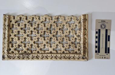 Ventilation grate with an geometric decorative design. 