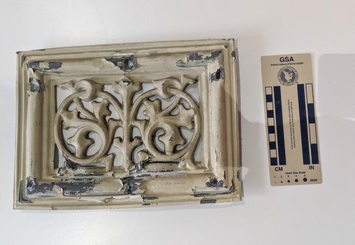 Cream painted Lead ventilation grate with geometric design.