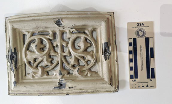 Cream painted Lead ventilation grate with geometric design.