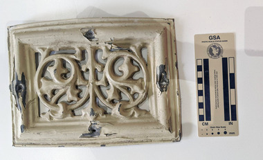 Cream painted Lead ventilation grate with geometric design.