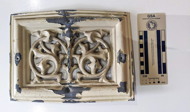 Cream painted Lead ventilation grate with geometric design.