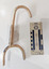 Iron hook with a wall plate painted in cream.
